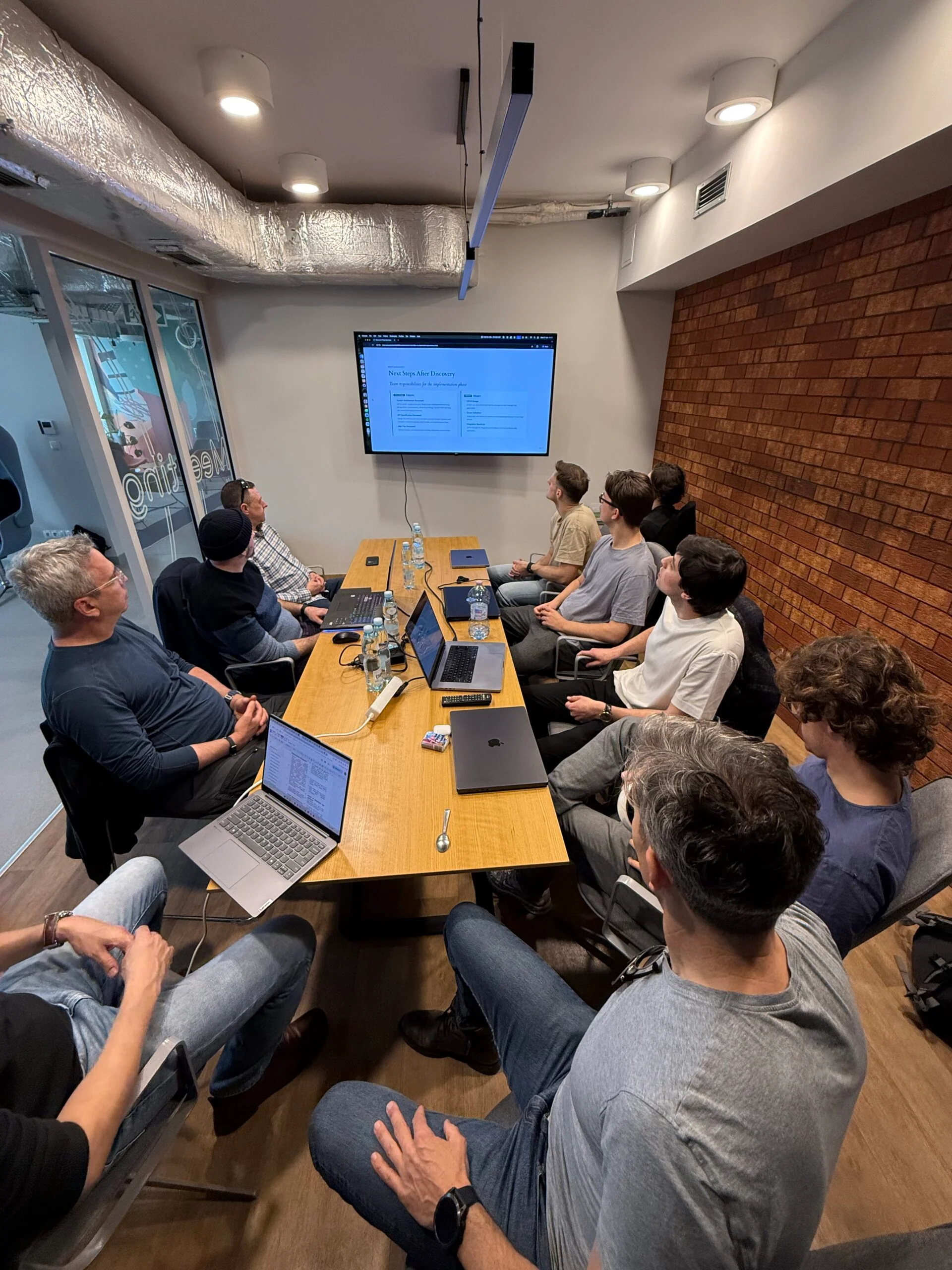 Vstorm team reviewing an agentic AI implementation plan in a workshop